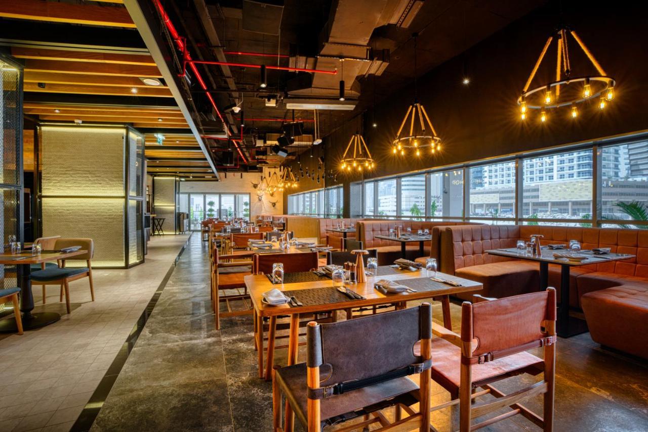 Hotel The First Collection Dubai Business Bay Extérieur photo Interior of the restaurant
